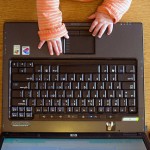 Baby hands with laptop
