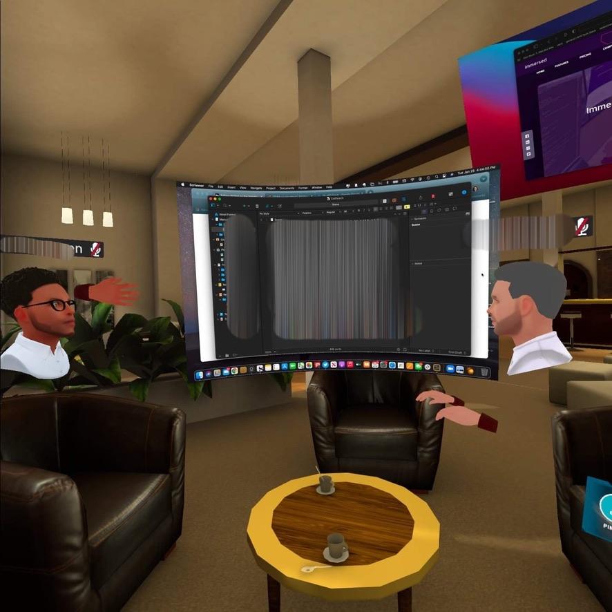 Virtual monitor shown by two avatars in cafe chairs