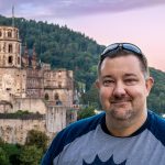 author headshot with background castle